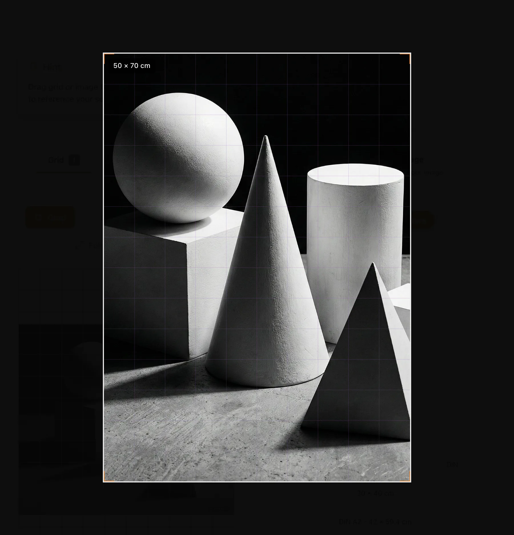The crop frame labelled 50 by 70 centimetres over a still life of white geometric solids, with the area outside the frame dimmed